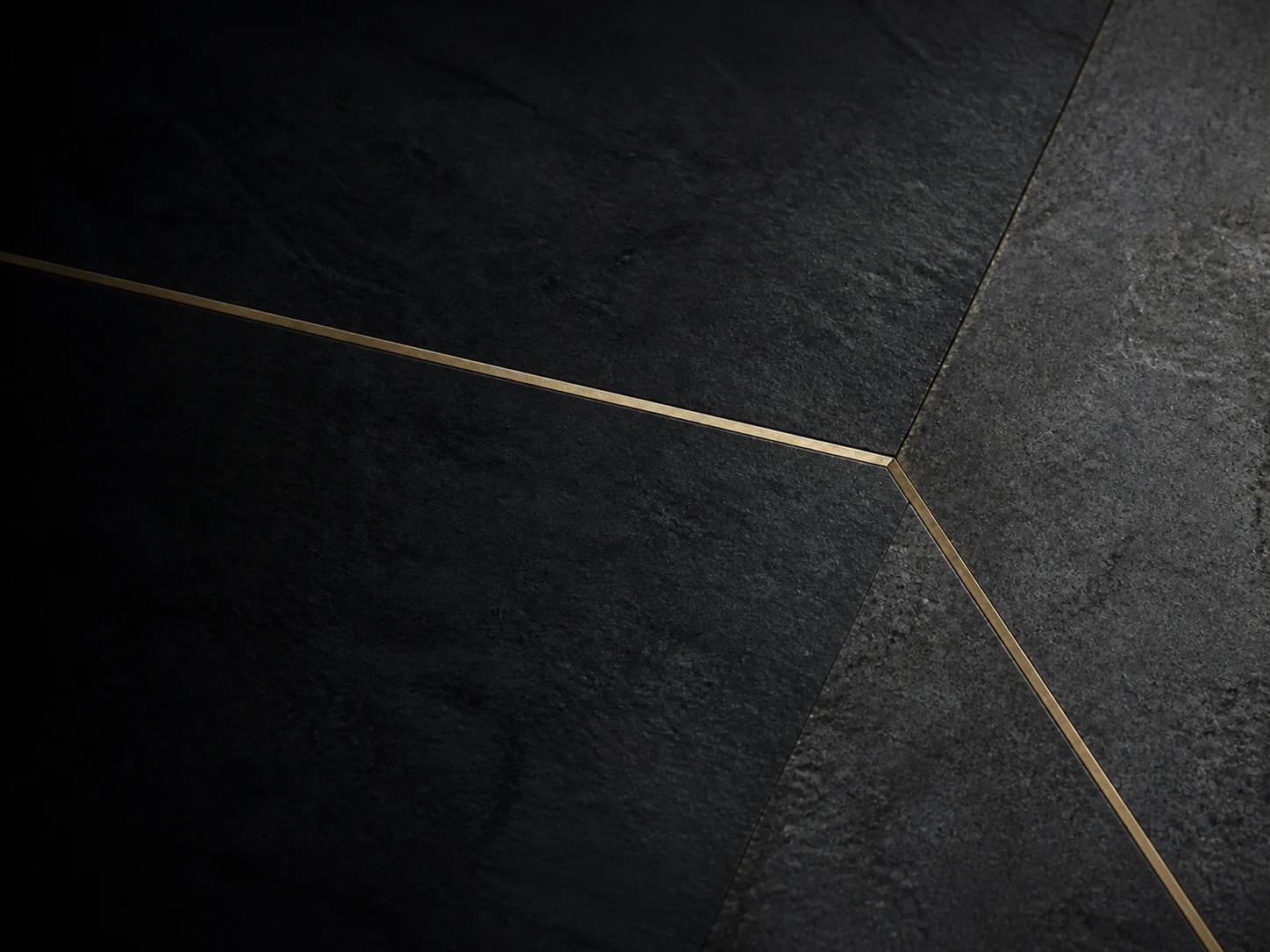 Three brass lines converging across dark stone planes