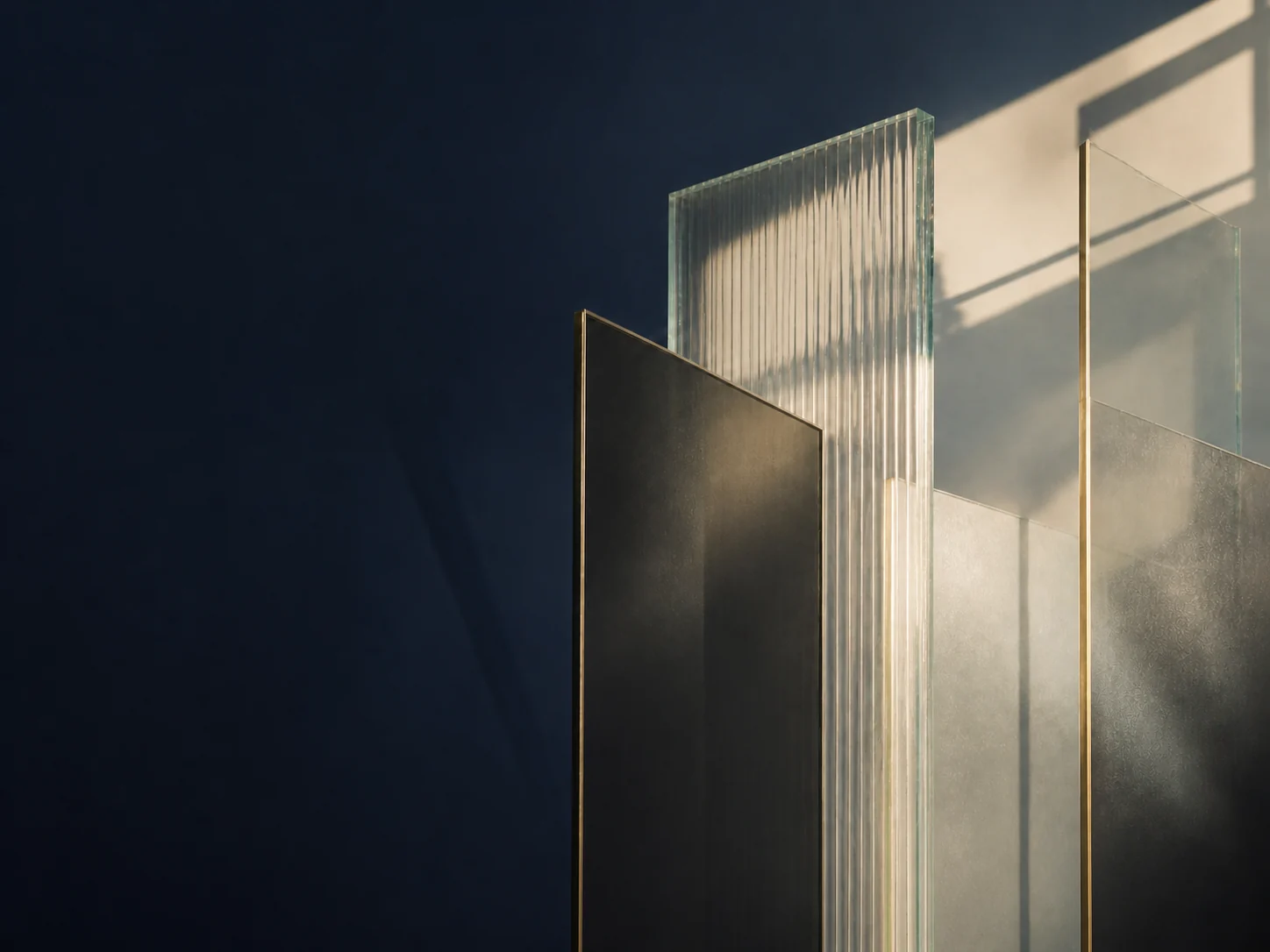 Dark, clear and fluted architectural panels with brass edges